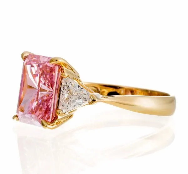 Radiant and Triangle Cut Pink Cubic Zirconia Engagement Ring In Sterling Silver