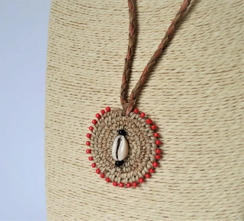 Woven African necklace with cowrie seashell