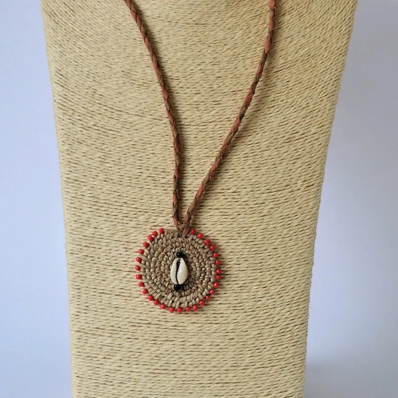 Woven African necklace with cowrie seashell